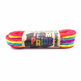 A pair of rainbow pride laces (standard) in Stonewall Rainbow Laces paper packaging