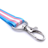 Lanyard with Trans Flag printed on it. Safety breakaway and metal trigger clip